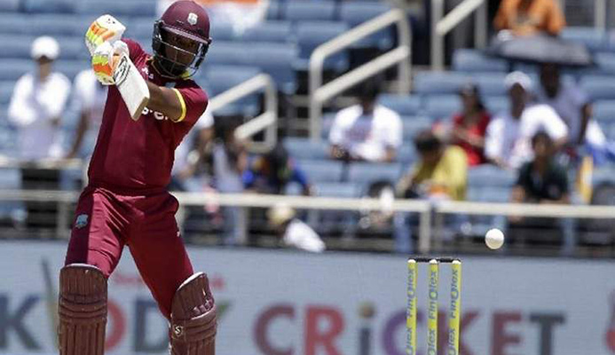 Bang!: West Indies opening batsman Evin Lewis smacks another delivery during his Man-of-the-Match 125 not out against India in their one-off T20 International at Sabina Park in Kingston, Jamaica, yesterday. West Indies won by nine wickets. —Photo: AP