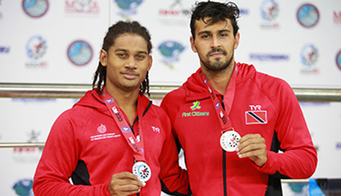Christian Awah and Dylan Carter lef to right display their medals, rduring the XXX CCCAN Swimming Championships 2017, at the National Aquatic Centre, Couva. Carter sent a new CCCAN record in 52.73.