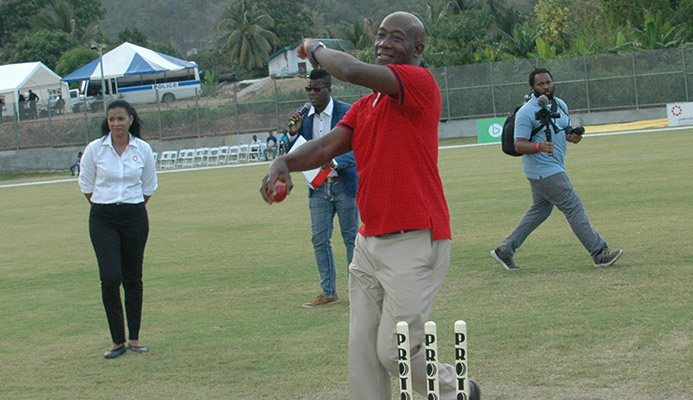 Prime Minister Dr Keith Rowley bowls the first ball during the opening of the Diego Martin Sporting Complex in Diego Martin, on Sunday.