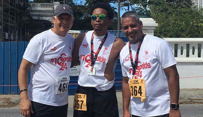 TTOC president Brian Lewis, centre, is flanked by Agriculture Minister Clarence Rambharat,left, and Mayor of Port of Spain Joel Martinez, who completed in the T&T International Marathon (TTIM), last year. Lewis and Minister Rambharat participated in this year's marathon walk.  @courtesy TTOC