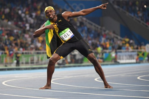 Photo: Jamaica’s Usain Bolt celebrates after winning the 100 metre Olympic final for a record third successive time at the Rio 2016 Olympic Games on 14 August 2016.  (Copyright AFP 2016/Wired868)