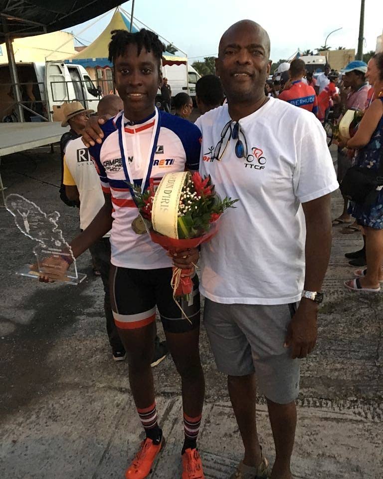 TT women's pro cyclist Teniel Campbell (left), celebrates her 2017 Caribbean Road Cycling Championships double-gold with PSL club manager Desmond Roberts. After being overlooked by the local cycling fraternity for the 2017 meet, Roberts funded Campbell's trip which served as a launching pad to her becoming TT's first-ever women's pro road cyclist. -