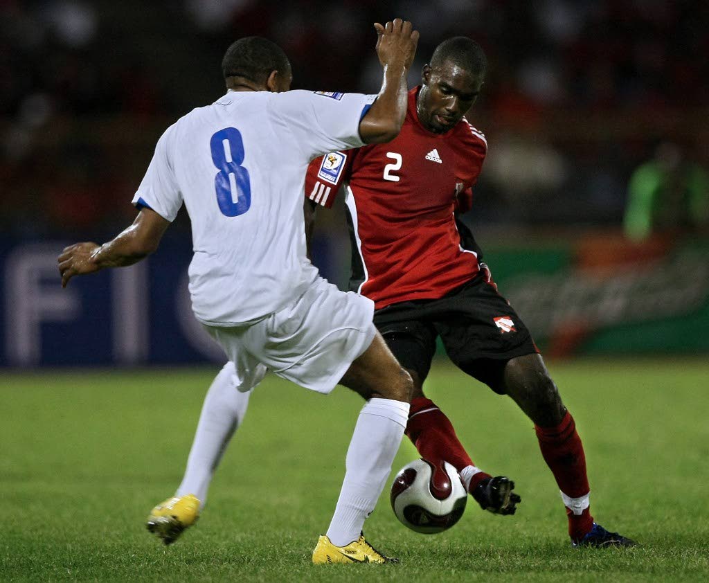 In this file photo, Trinidad & Tobago's Clyde Leon (R) vies for the ball with Honduras' Osman Chavez during their FIFA World Cup South Africa-2010 qualifier match at Hasely Crawford stadium in Port of Spain on March 28, 2009 -