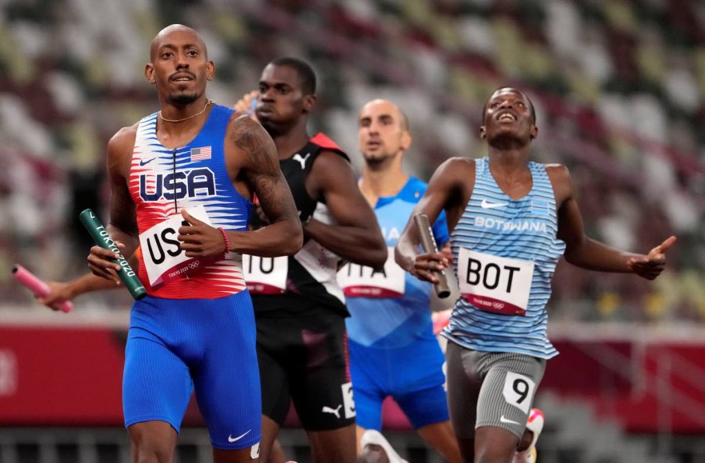 Trinidad and Tobago's Dwight St Hillaire (second from left) trails Vernon Norwood of the United States, during the semifinal of the men's 4x400-metre relay at the 2020 Summer Olympics, on Friday, in Tokyo, Japan. (AP PHOTO) -