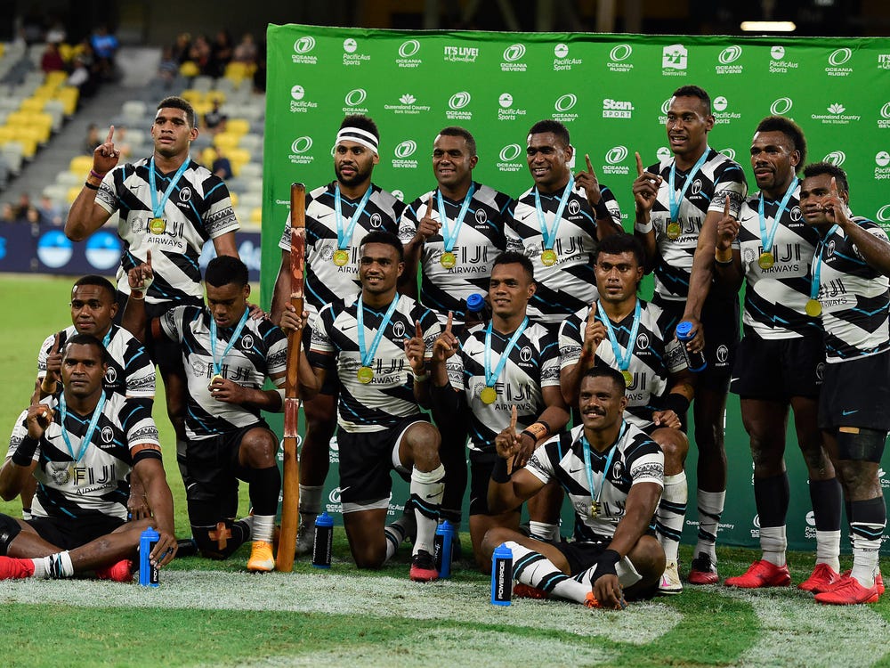 The Fiji team pose for a photo after winning the Oceania Sevens Challenge at Queensland Country Bank Stadium in Townsville, Australia, June 27, 2021. Ian Hitchcock/Getty Images