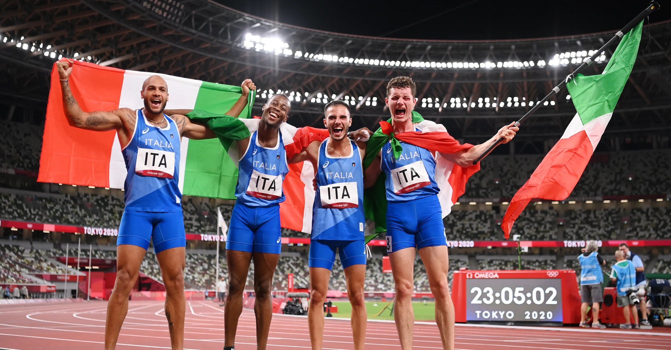 TOKYO, JAPAN - AUGUST 06: Lorenzo Patta, Lamont Marcell Jacobs, Eseosa Fostine Desalu and Filippo Tortu of Team Italy celebrate winning the gold medal in the Men's 4 x 100m Relay Final on day fourteen of the Tokyo 2020 Olympic Games at Olympic Stadium on August 06, 2021 in Tokyo, Japan. (Photo by Matthias Hangst/Getty Images) 2021 Getty Images