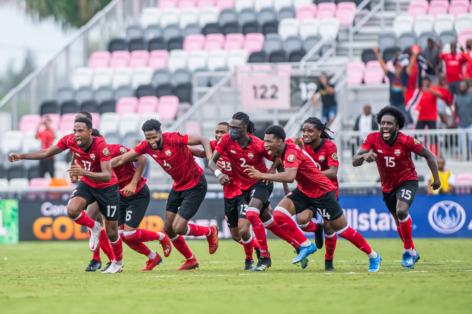 Photo: Trinidad and Tobago players celebrate after defeating in a dramatic 8-7 penalty shootout to French Guiana following a 1-1 draw in the Second Round of the 2021 Gold Cup Prelims on July 6 2021, at DRV PNK Stadium in Fort Lauderdale, Florida.