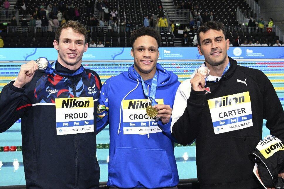 FASTEST MEN: Jordan Crooks for the Cayman Islands, centre, Benjamin Proud from Britain, left, and Dylan Carter from Trinidad and Tobago display their medals after the Men’s 50-metre freestyle at the World Short Course Swimming Championships in Melbourne, Australia, yesterday. Crooks won the gold, Proud the silver and Carter took the bronze. —Photo: AP (The TTOC obtained this image via trinidadexpress.com)