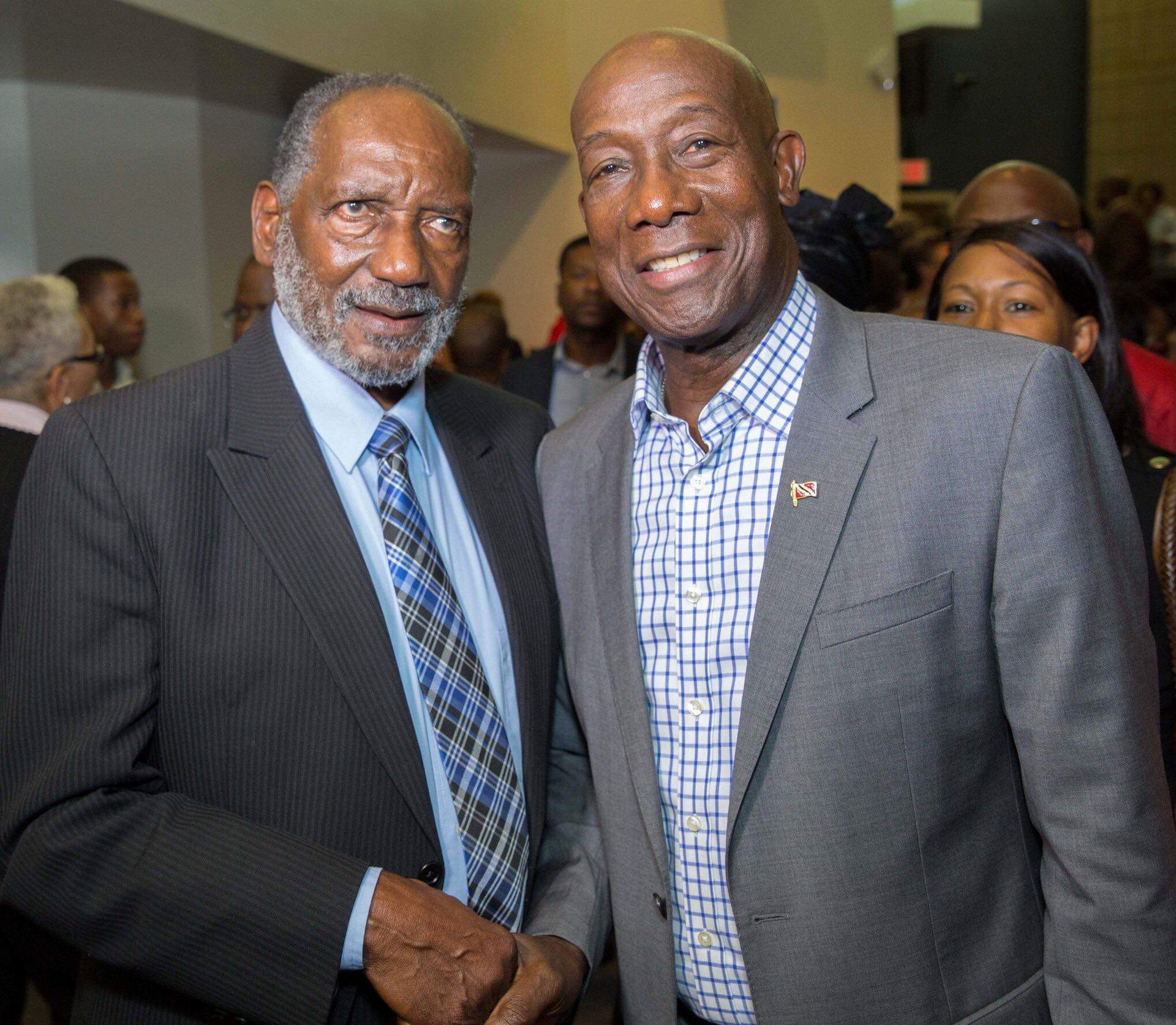 ormer national goalkeeper and coach Lincoln Phillips, left, with T&T Prime Minister Dr Keith Rowley in September 2019.