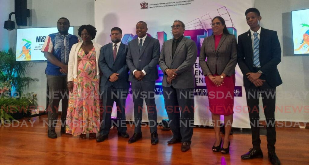 Minister of Youth Development and National Service Foster Cummings, centre, with ministry officials and and youth worker conference facilitators at the ministry's launch of its Youth Week activities at the UWI's Teaching and Learning Centre, St Augustine, on Tuesday. - PAULA LINDO (Image obtained at newsday.co.tt)