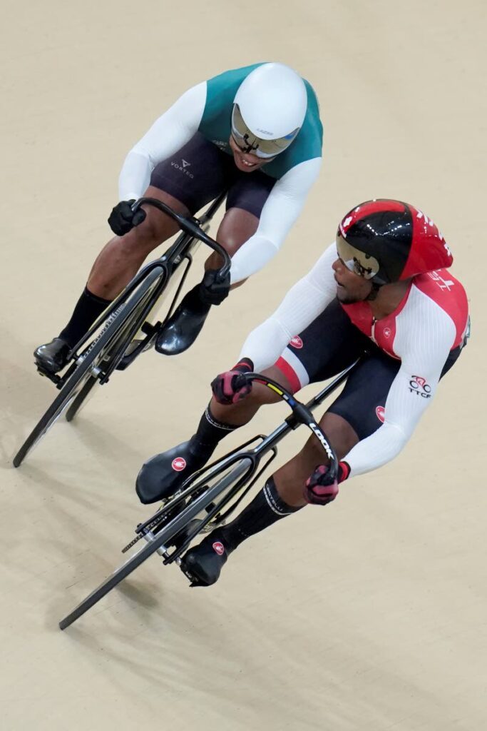 Trinidad and Tobago's Nicholas Paul, right, and Suriname's Jair Tjon, compete in the men's sprint final at the Pan American Games in Santiago, Chile, on October 26. - AP PHOTO (Image obtained at newsday.co.tt)