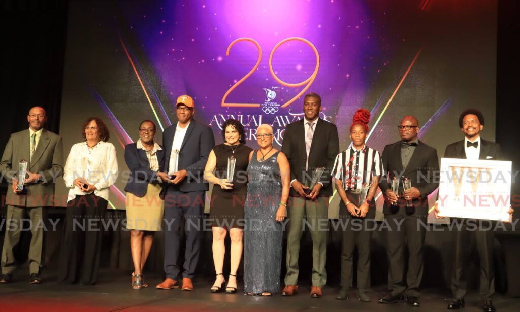 TTOC president Diane Henderson, fifth from right, with awardees at the TTOC awards function at Hyatt, Port of Spain on Friday. - ROGER JACOB (Image obtained at newsday.co.tt)