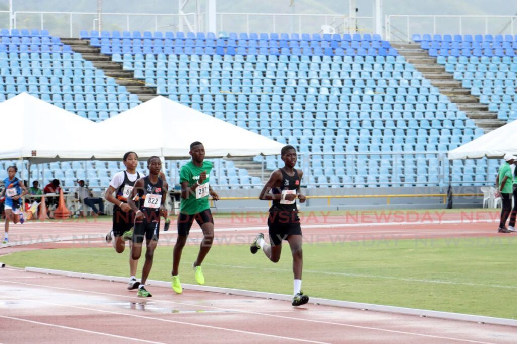 Participants compete in the Boys Under-15 800m heat at the National Juvenile Track and Field Championship at Hasely Crawford Stadium, Port of Spain on May 2. - Photo by Venessa Mohammed