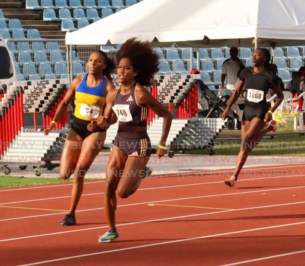 Simplex sprinter Sole Frederick, centre, on the way to victory in the women's 200m final at the NAAA National Championships. - ROGER JACOB (Image obtained at newsday.co.tt)
