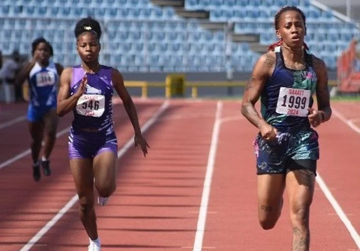 HALF-LAP GOLD: Michelle-Lee Ahye, right, en route to victory in the National Association of Athletics Administrations (NAAATT) Track and Field Series #3 women’s 200 metres event at the Hasely Crawford Stadium, in Port of Spain, yesterday. Ahye clocked 23.53 seconds to finish ahead of Symphony Patrick, left, the runner-up in 24.25. —Photo: PAUL VOISIN (Image obtained at trinidadexpress.com)