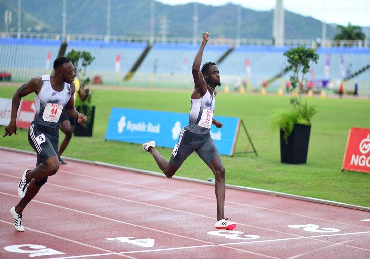FLASHBACK: With thousands of empty seats in the background, Jereem “The Dream” Richards, right, celebrates his victory in the 2019 NGC NAAA Open Track and Field Championship men’s 200 metres final at the Hasely Crawford Stadium, in Port of Spain. Richards won in 20.14 seconds. Kyle Greaux, left, finished second in 20.18.  —Photo: DENNIS ALLEN for @TTGameplan (Image obtained at trinidadexpress.com)
