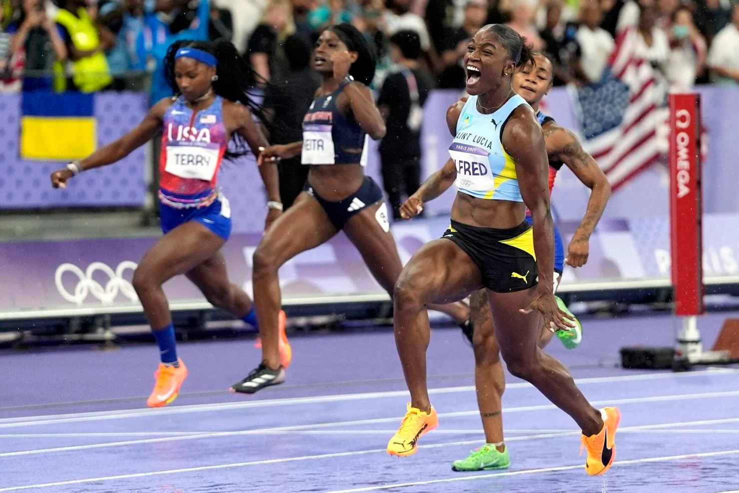 UNSTOPPABLE: Julien Alfred, of St Lucia, celebrates after dashing to women’s 100m gold in the final at the 2024 Summer Olympics, yesterday, in Saint-Denis, France. —Photos: AP  Matthias Schrader (Image obtained at trinidadexpress.com)