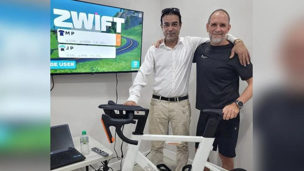 FLASHBACK: Former national road and track national cycling champion Richard Dickie, left, and Courtenay Rooks, introducing the Zwift virtual cycling programme to get people moving. (Image obtained at trinidadexpress.com)