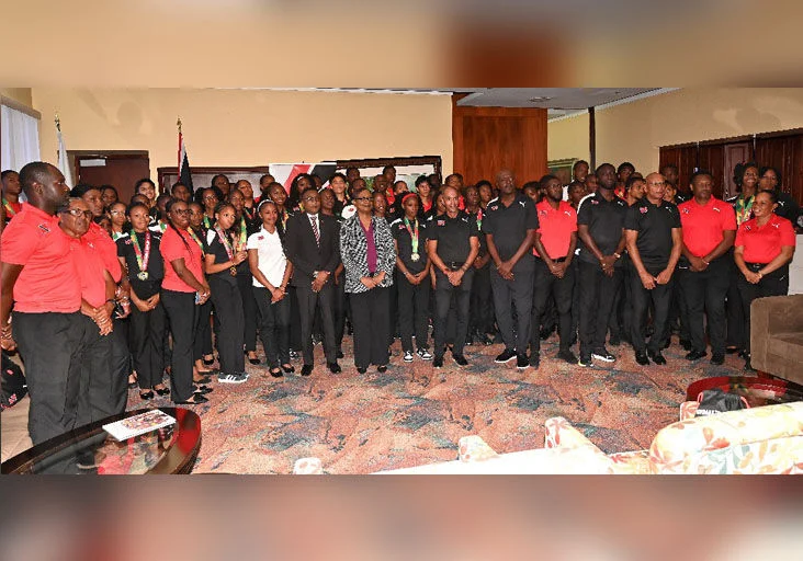 T&T PRIDE: Sport Minister Phillip Watts, centre, and Permanent Secretary in the Ministry of Sport and Youth Affairs Penelope Bradshaw-Niles, next to the  minister, were on hand to welcome returning members of the T&T Carifta Games contingent upon their arrival from Grenada, at the VIP Lounge, Piarco  @Caption:International Airport, yesterday. —Photo: ISHMAEL SALANDY (Image obtained at trinidadexpress.com)