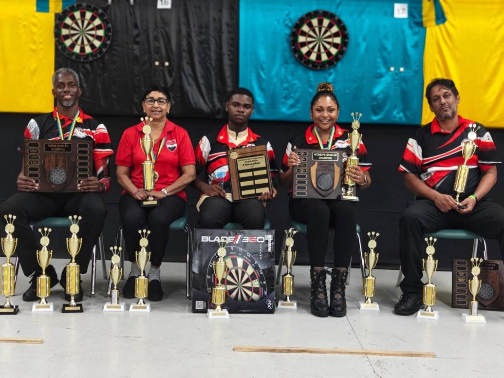 SHOWING OFF THEIR SILVERWARE: Members of the T&T darts team at the Caribbean Championships in Nassau, Bahamas, Joshua Balfour, from left, Karen Ramcharan, Joshua Young, Kimberly Rivas and James Walklin. (Image obtained at trinidadexpress.com)